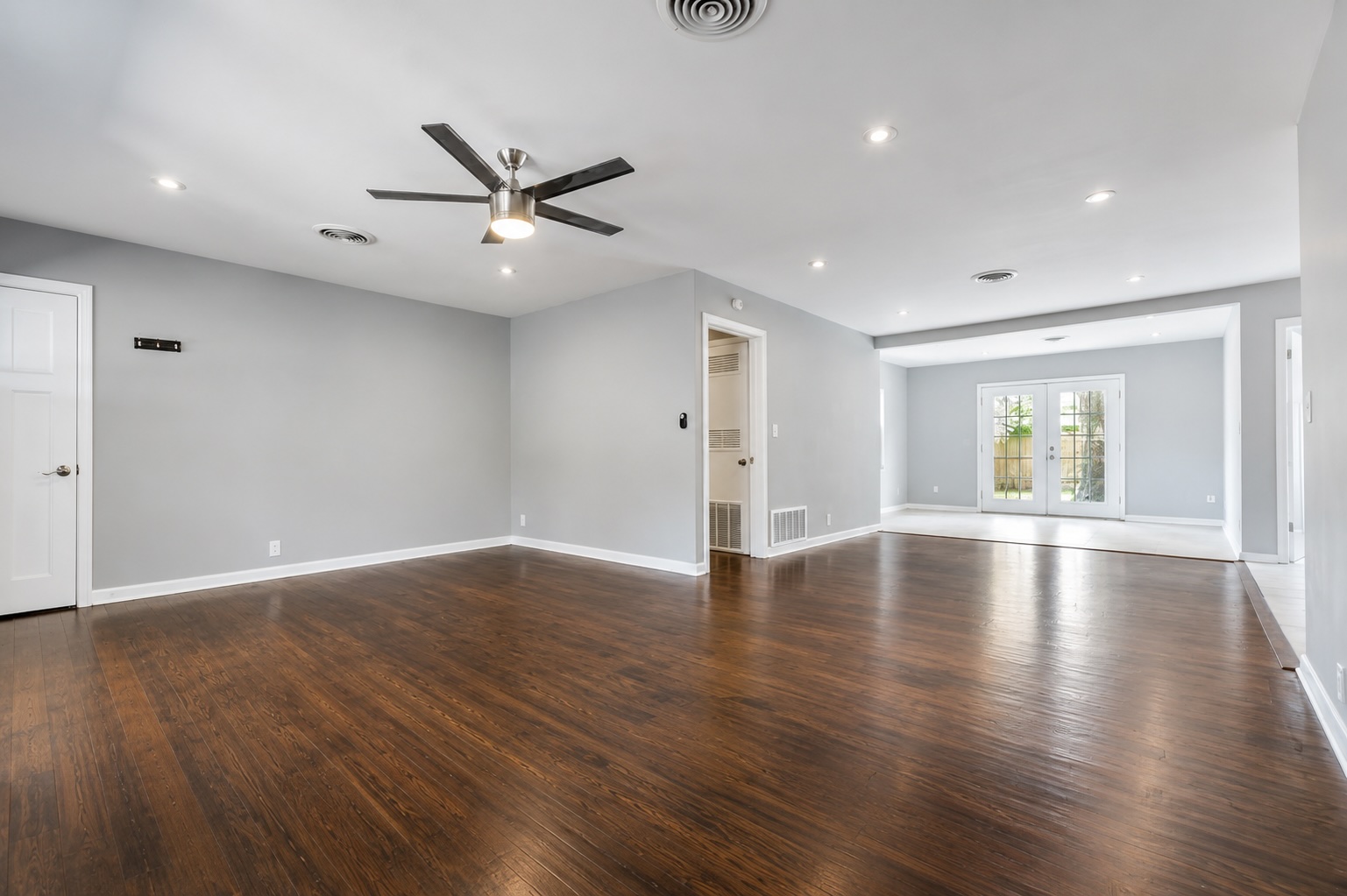 2105 Fortview Road Austin, TX 78704 - Photo 6 of 37 Rich hardwood floors flow through this luminous open-concept living space with ample recessed lighting.