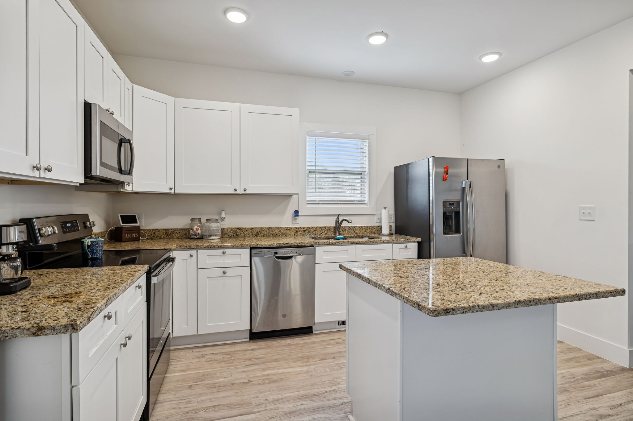 137 Mt Vernon Church Road Bethpage, TN 37022 - Photo 20 of 44 a kitchen with stainless steel appliances granite countertop a sink stove and refrigerator