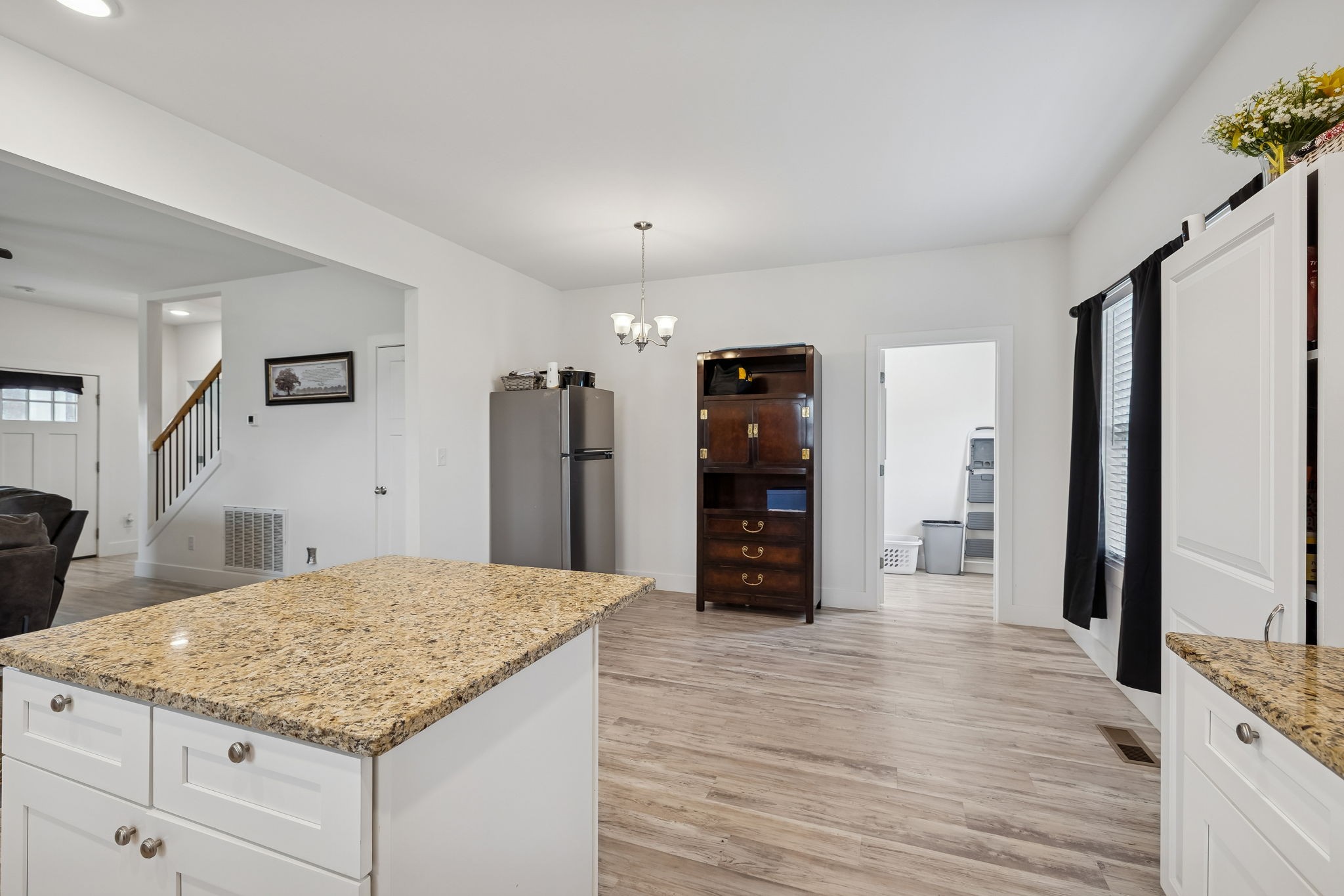 137 Mt Vernon Church Road Bethpage, TN 37022 - Photo 22 of 44 a kitchen with stainless steel appliances kitchen island granite countertop a refrigerator and a stove