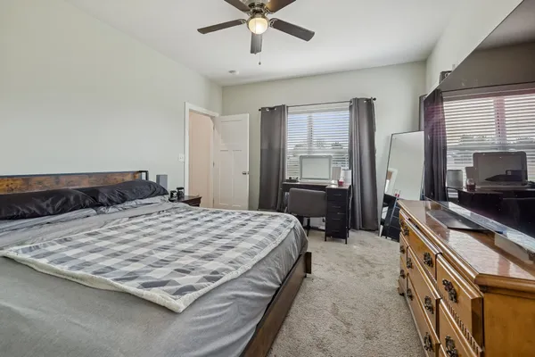 a view of a bathroom with a sink a mirror a vanity and shower view