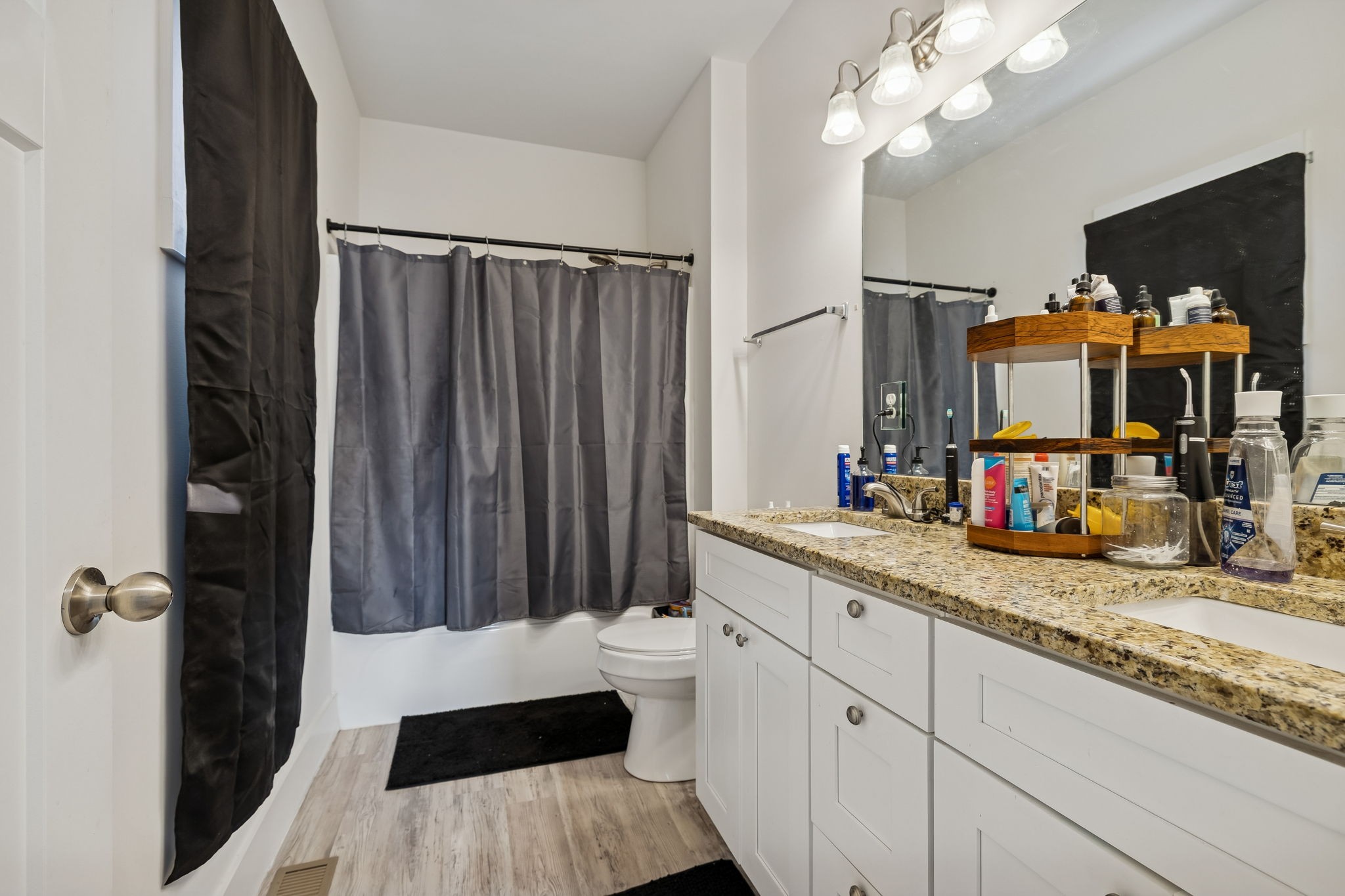 137 Mt Vernon Church Road Bethpage, TN 37022 - Photo 30 of 44 a view of a bathroom with a sink a mirror a vanity and shower view