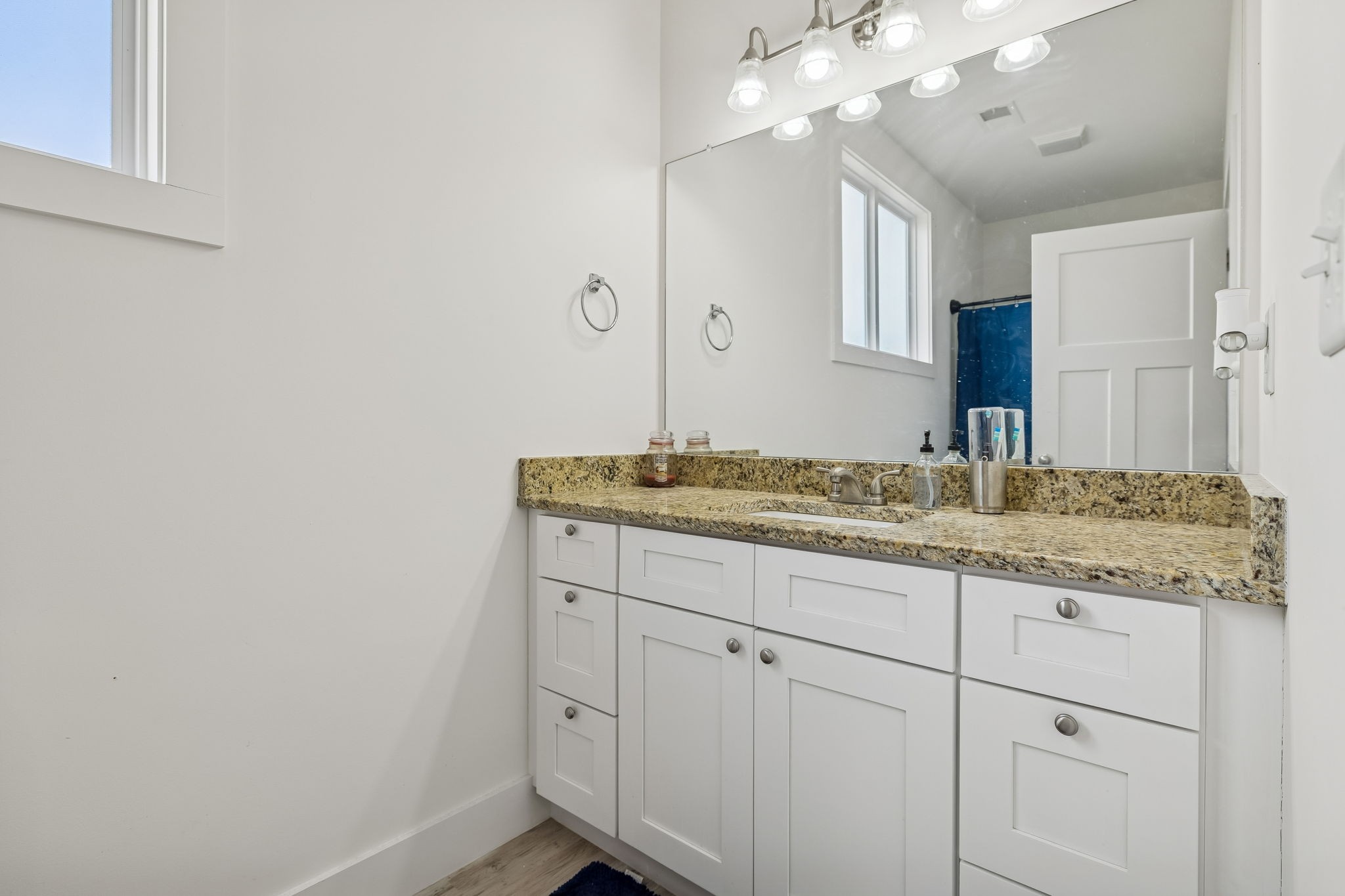 137 Mt Vernon Church Road Bethpage, TN 37022 - Photo 34 of 44 a bathroom with a granite countertop sink and a mirror