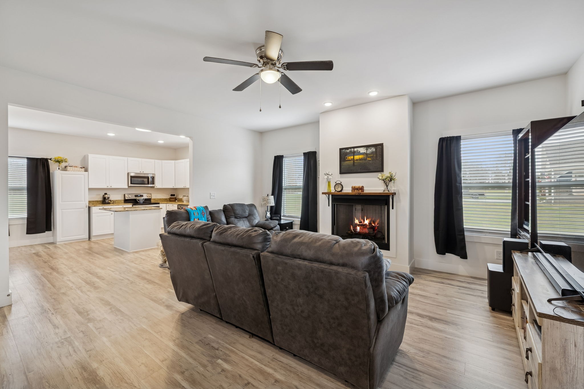 137 Mt Vernon Church Road Bethpage, TN 37022 - Photo 9 of 44 a living room with furniture and a fireplace