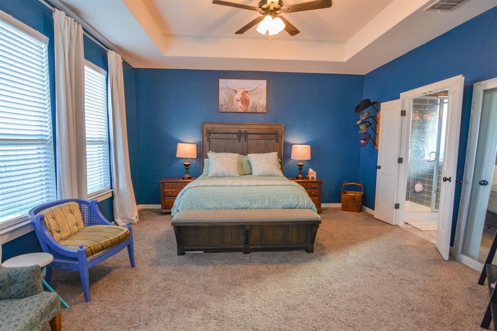 601 Mathew Street Grandview, TX 76050 - Photo 20 of 40 a bedroom with a bed chair and a large window