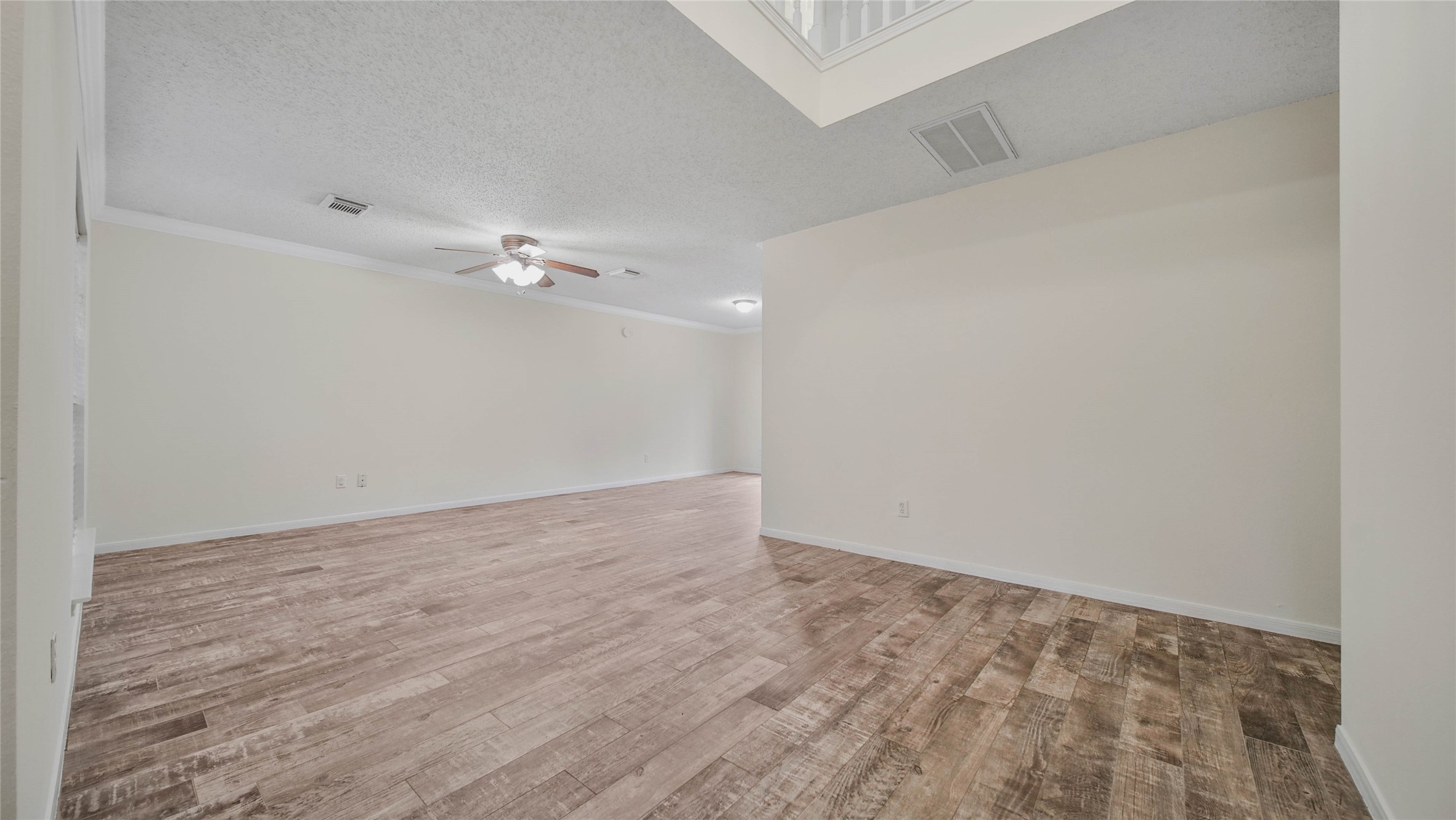 8826 Sunny Point Drive Spring, TX 77379 - Photo 11 of 16 a view of a room with wooden floor