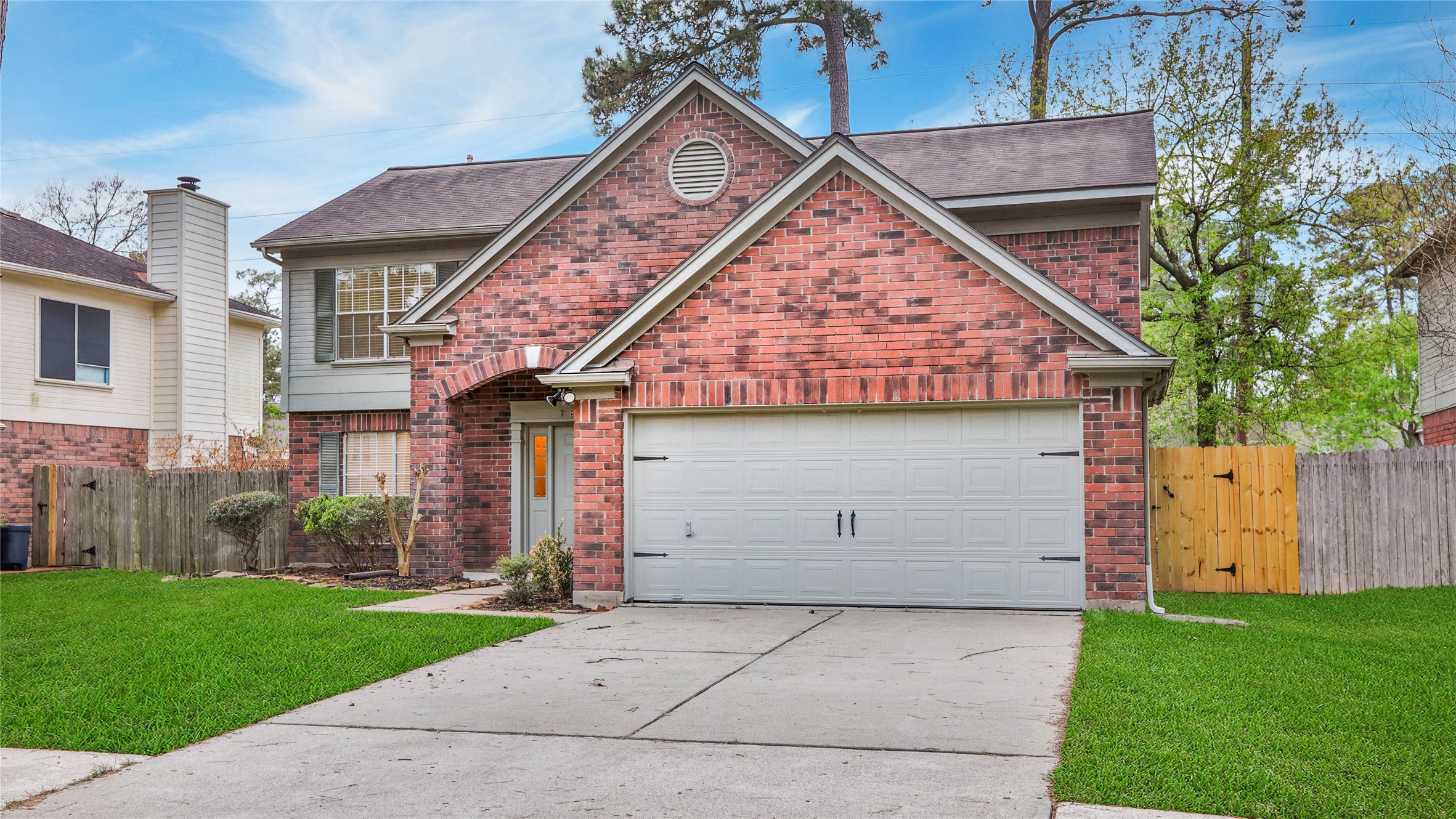8826 Sunny Point Drive Spring, TX 77379 - Photo 3 of 16 front view of house with a yard