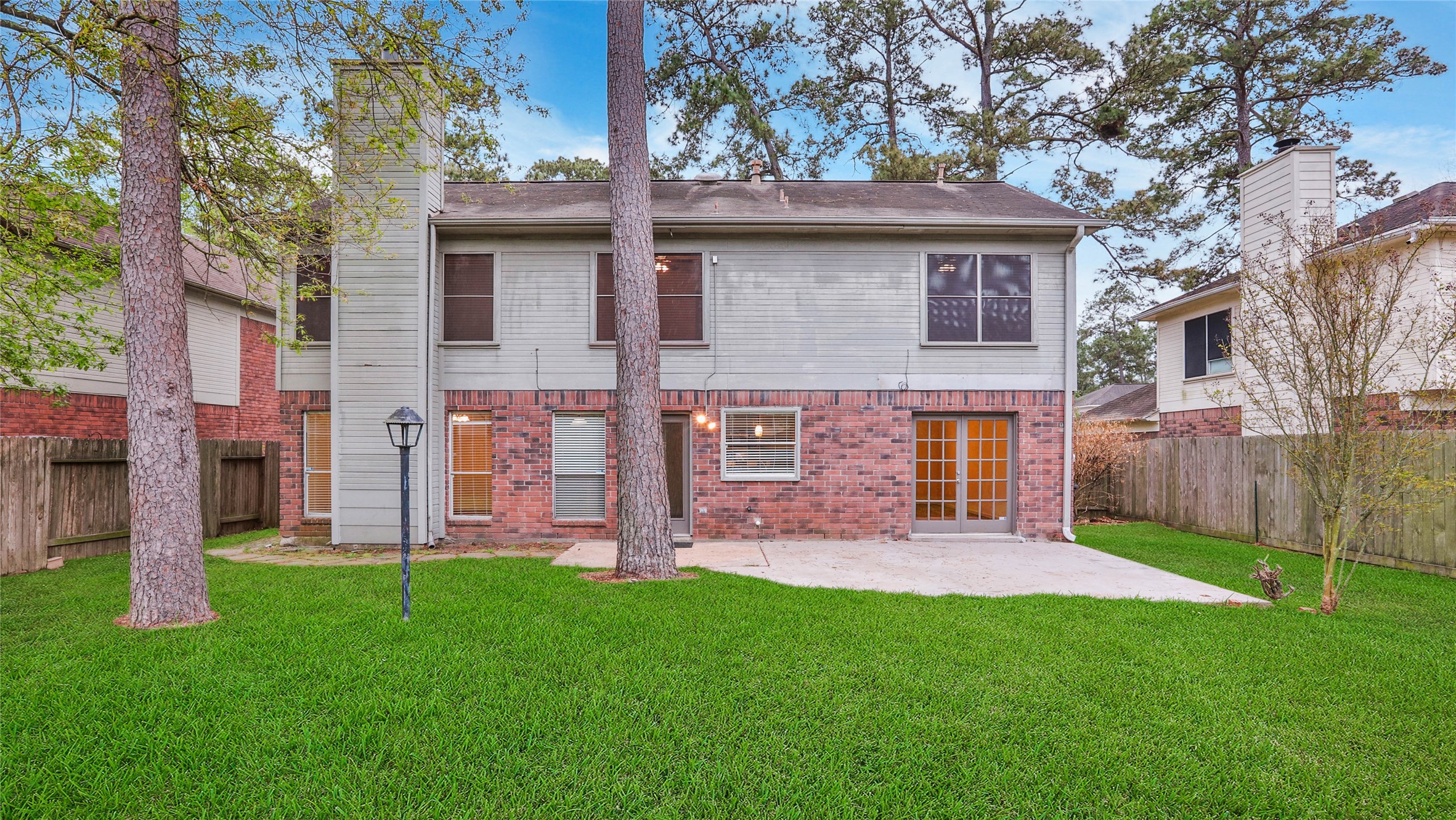 8826 Sunny Point Drive Spring, TX 77379 - Photo 4 of 16 a view of a house with a yard