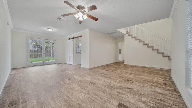 a view of an empty room with a window
