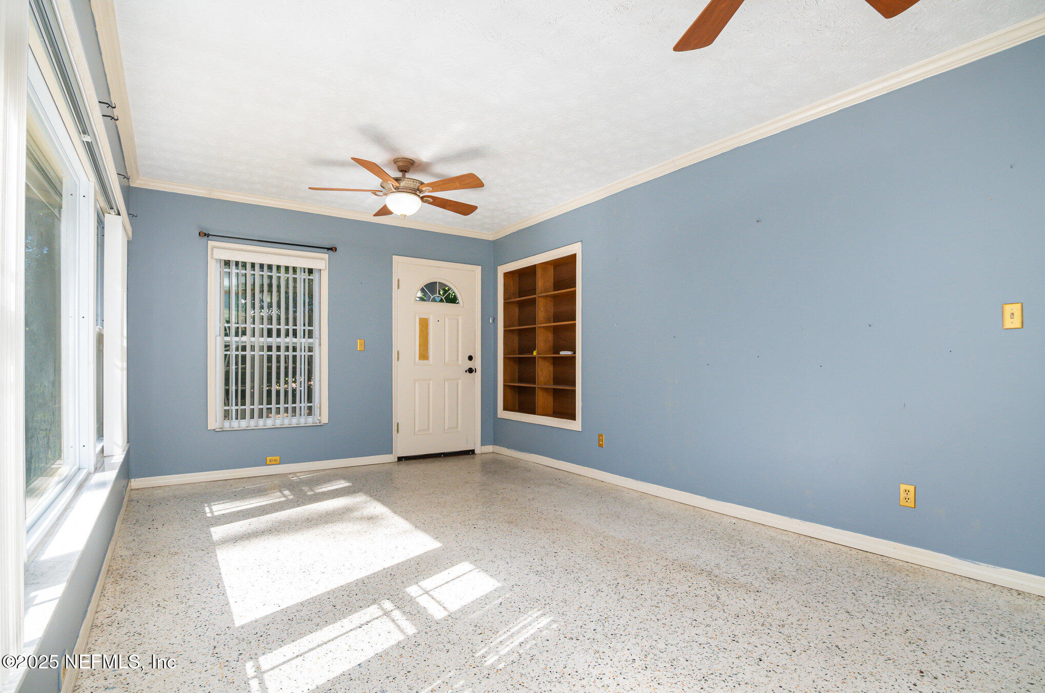 7838 State Road 21 Keystone Heights, FL 32656 - Photo 14 of 22 an empty room with windows and fan