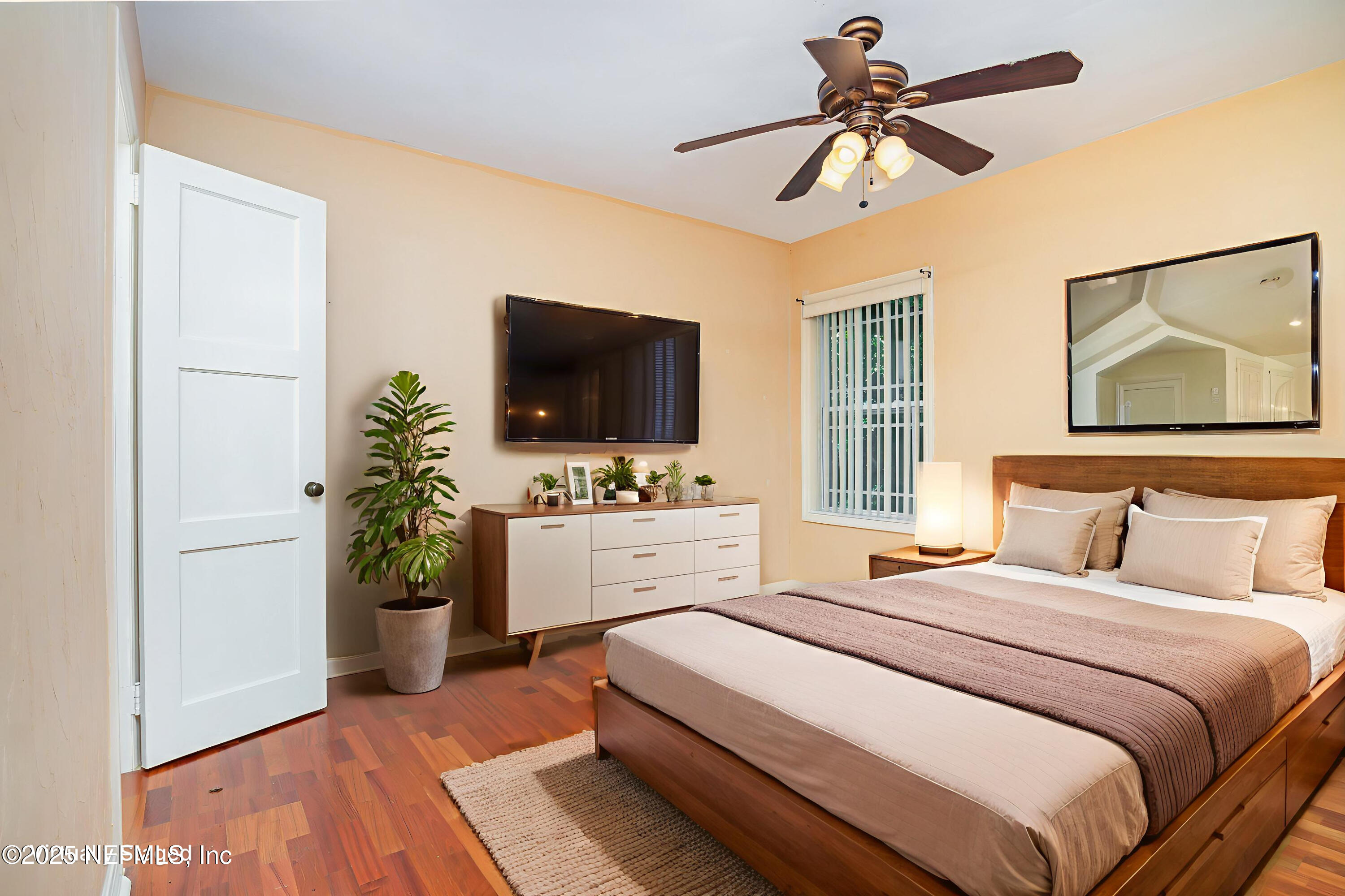 7838 State Road 21 Keystone Heights, FL 32656 - Photo 16 of 22 a bedroom with a bed and a flat screen tv