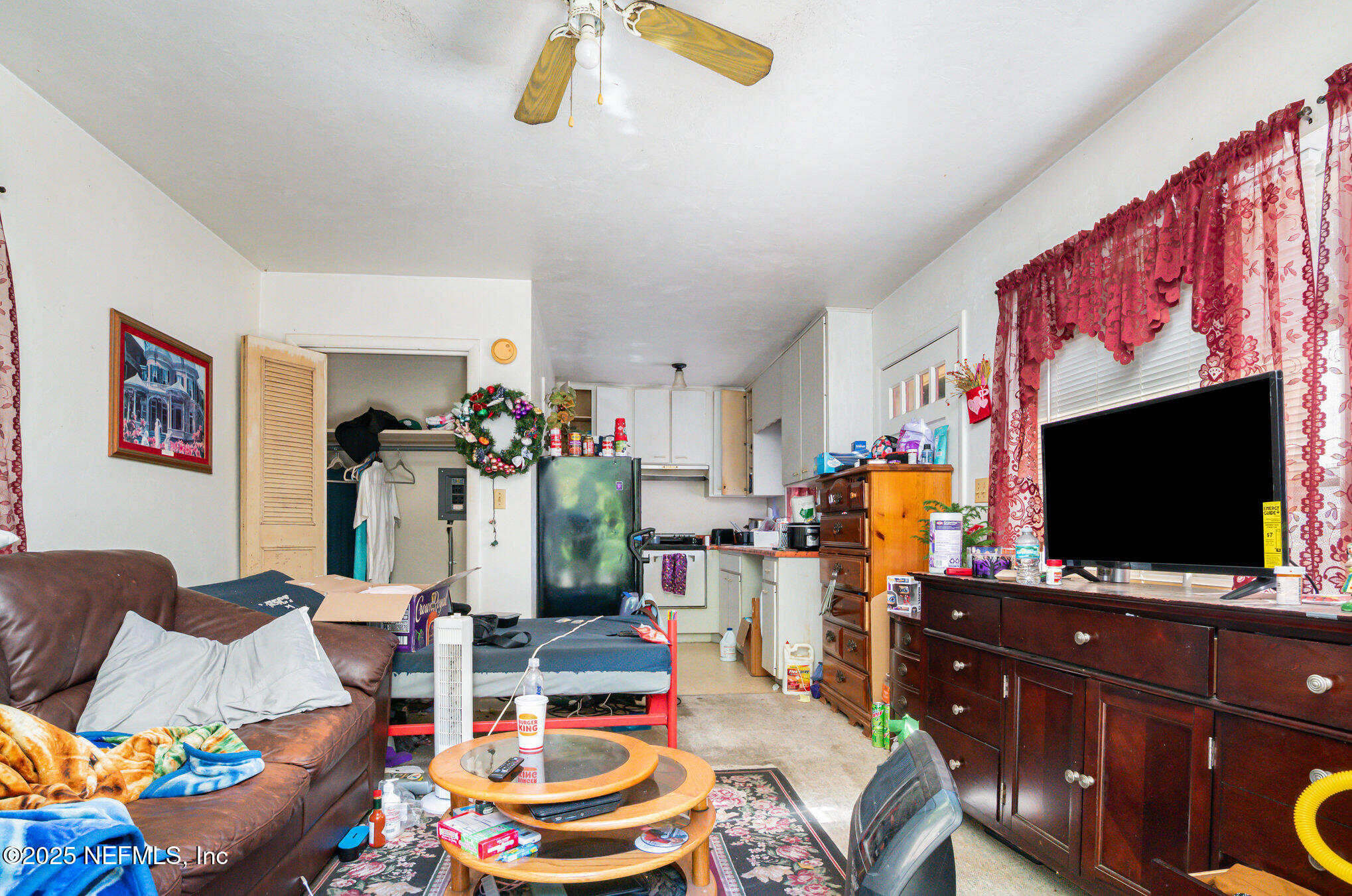 7838 State Road 21 Keystone Heights, FL 32656 - Photo 21 of 22 a living room with furniture and a flat screen tv