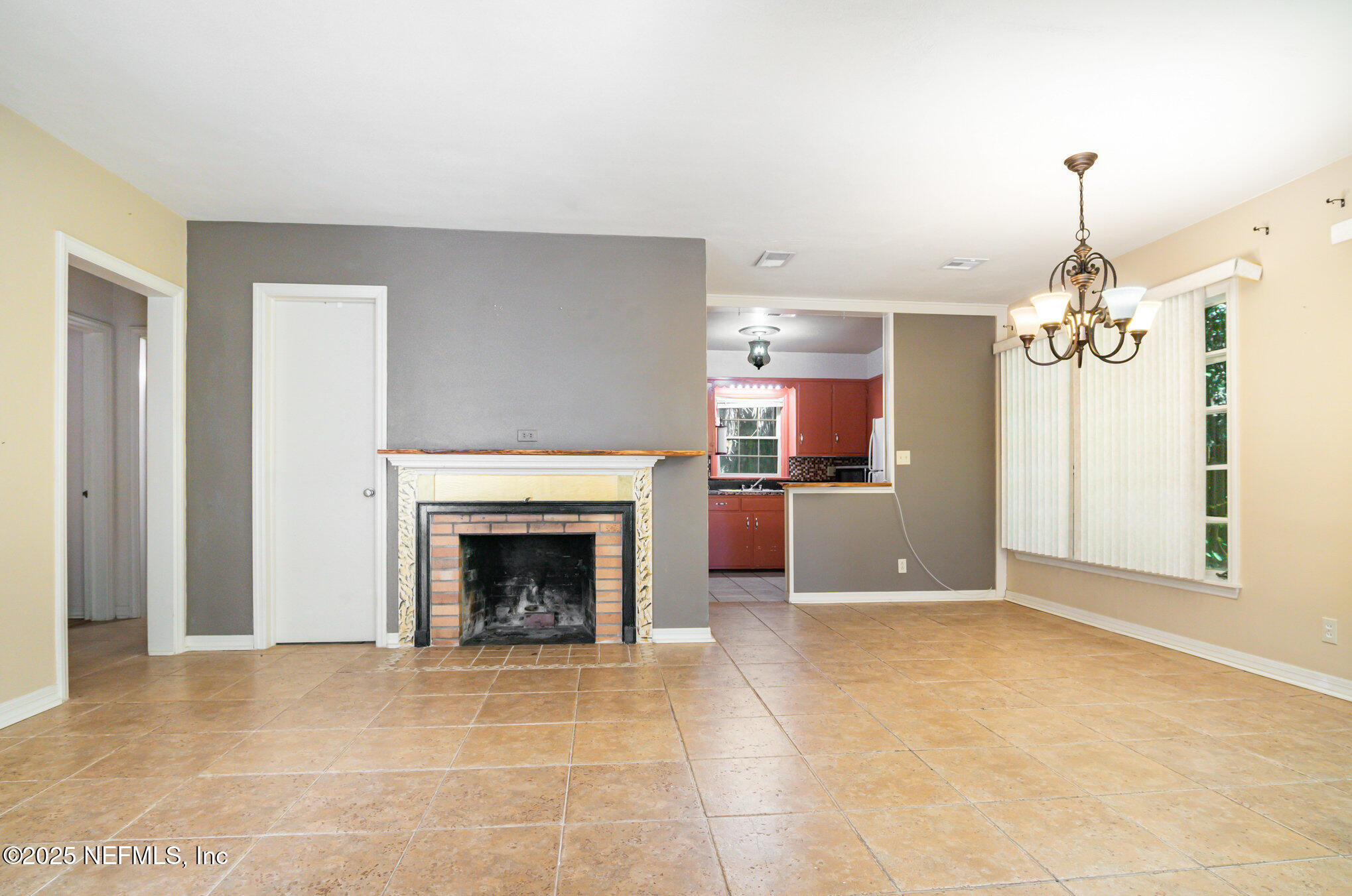 7838 State Road 21 Keystone Heights, FL 32656 - Photo 8 of 22 a view of a livingroom with a fireplace and cabinet