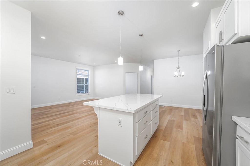 14851 Jeffrey Road, Unit 145 Irvine, CA 92618 - Photo 12 of 32 Island kitchen with pantry
