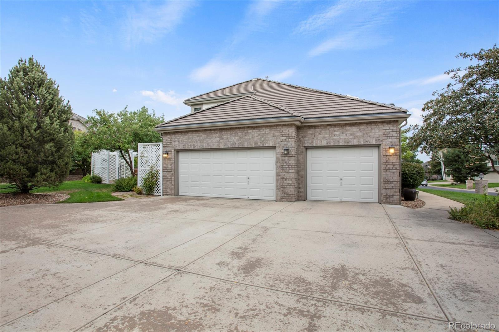 5703 Fig Way Arvada, CO 80002 - Photo 40 of 40 a front view of a house with a yard and garage