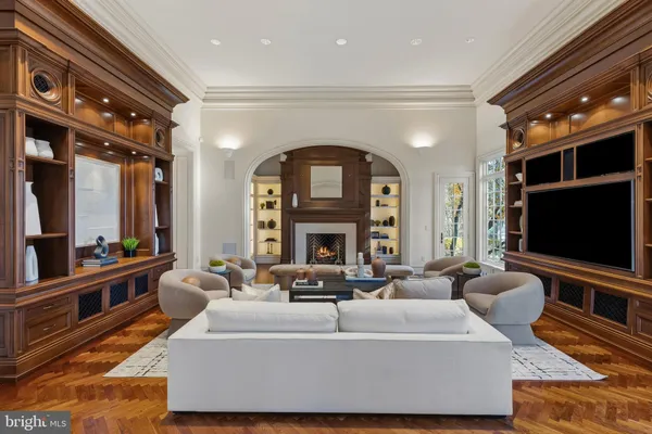 a living room with fireplace furniture and a flat screen tv