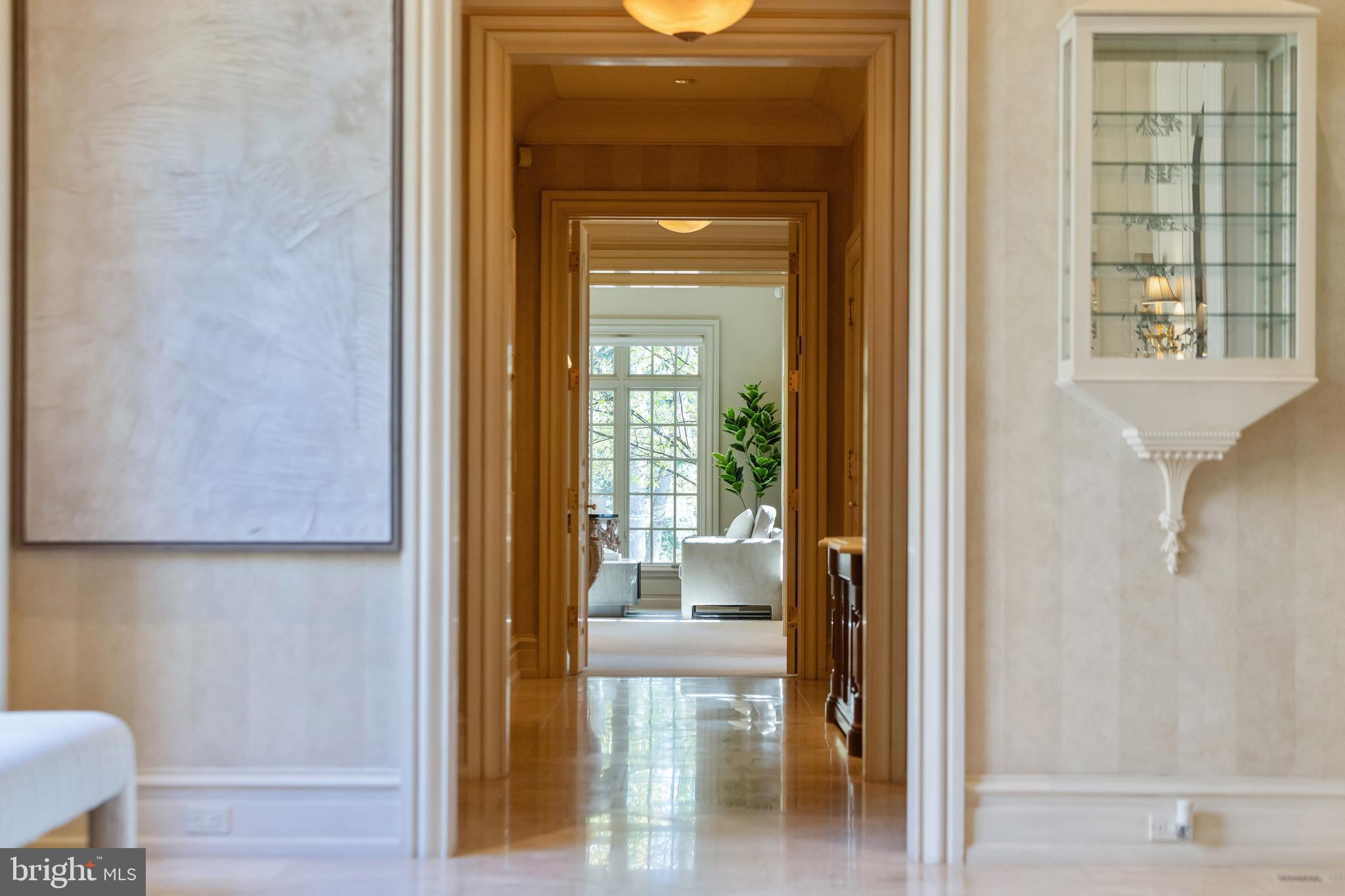 11315 John Carroll Road Owings Mills, MD 21117 - Photo 14 of 85 a view of a hallway with wooden floor and a dining room