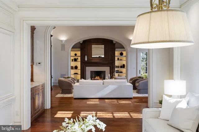 a view of a dining room with furniture and a chandelier