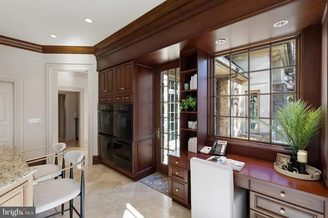 a spacious bedroom with a bed and a chandelier