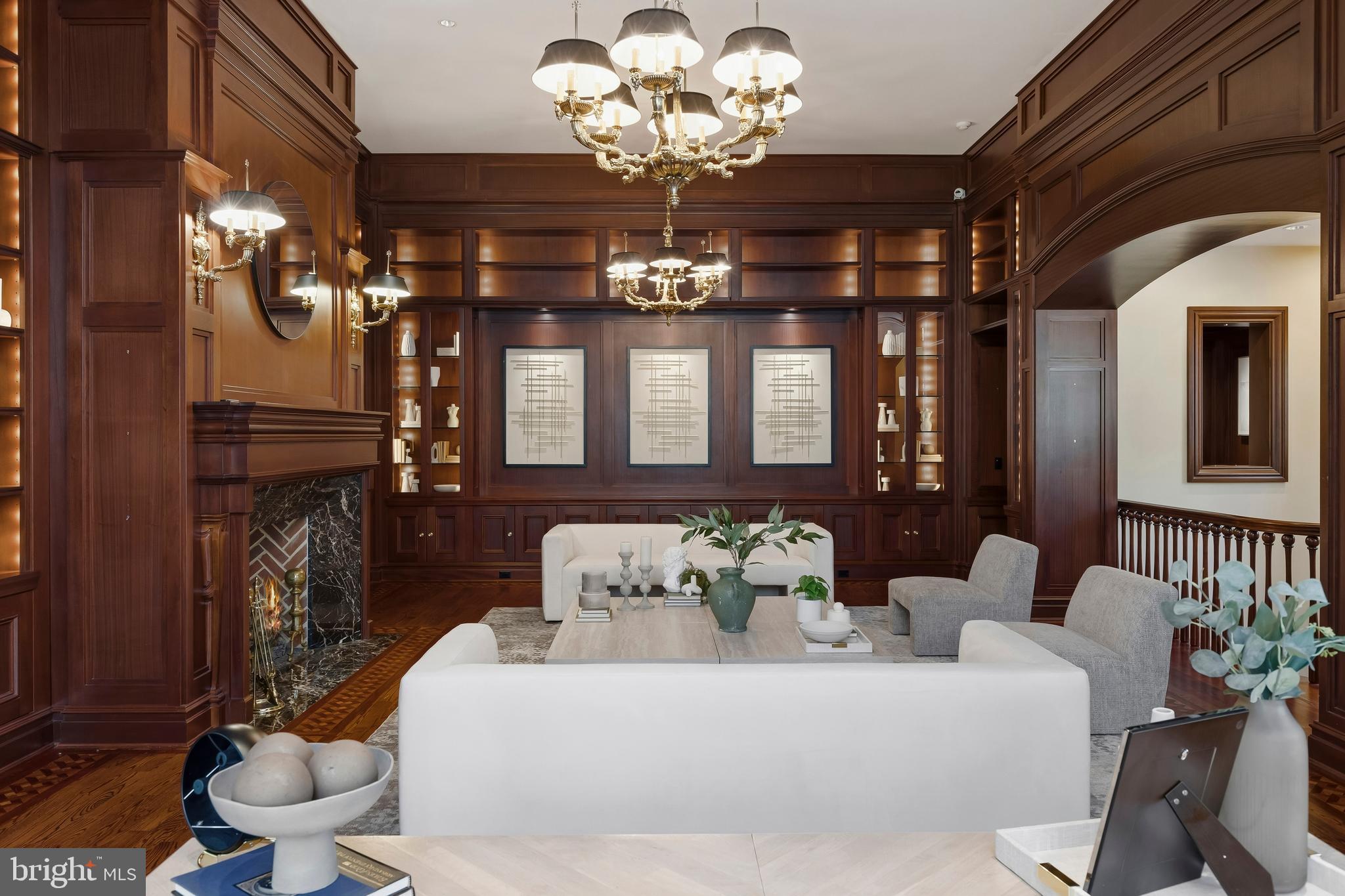 11315 John Carroll Road Owings Mills, MD 21117 - Photo 45 of 85 a living room with furniture a chandelier and a fireplace