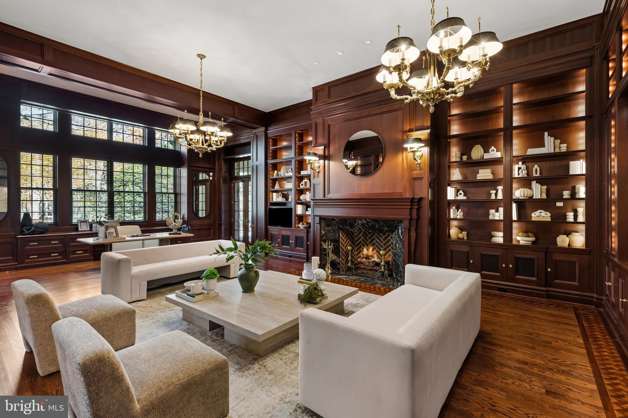 11315 John Carroll Road Owings Mills, MD 21117 - Photo 47 of 85 a living room with furniture a chandelier and a fireplace