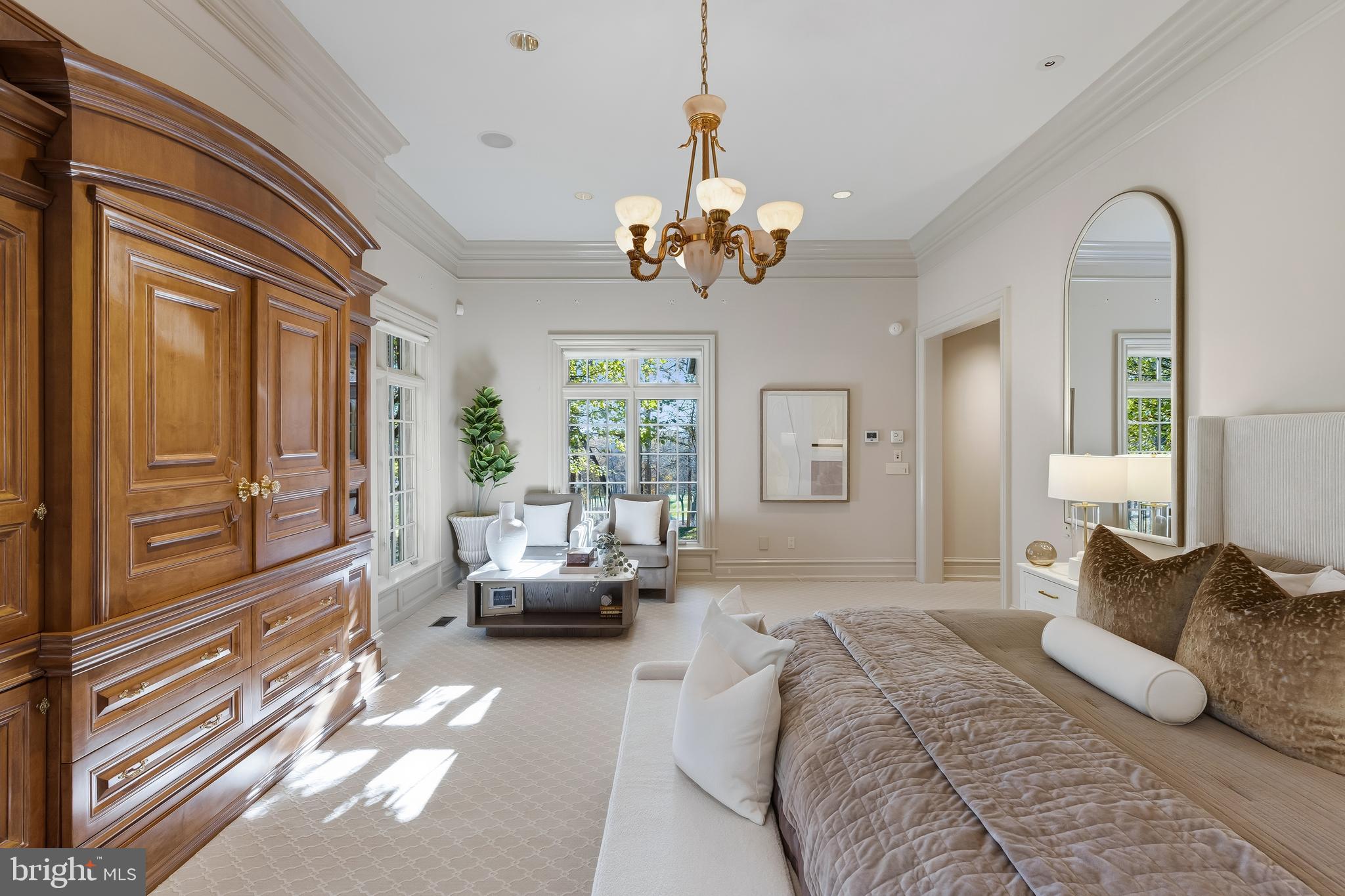 11315 John Carroll Road Owings Mills, MD 21117 - Photo 53 of 85 a spacious bedroom with a large bed and a chandelier
