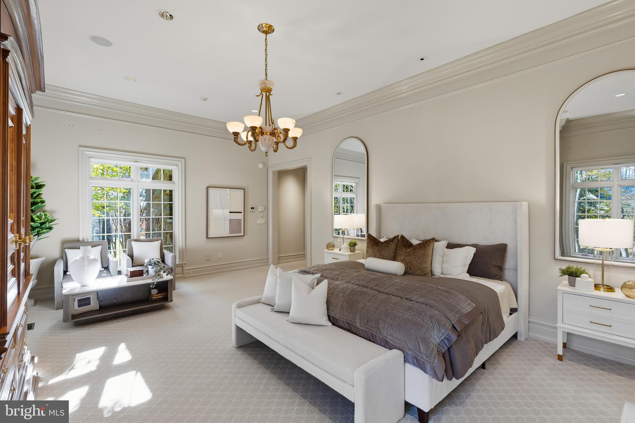 11315 John Carroll Road Owings Mills, MD 21117 - Photo 55 of 85 a spacious bedroom with a bed and a chandelier