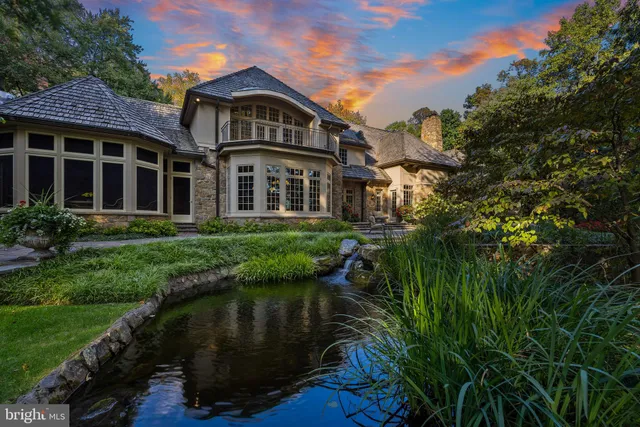 a view of a hallway with wooden floor and a dining room