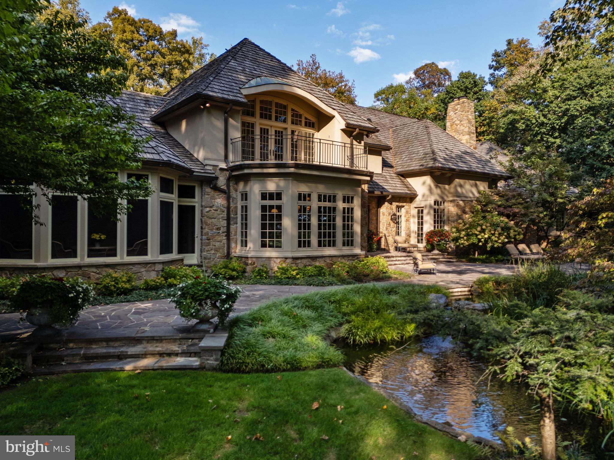 11315 John Carroll Road Owings Mills, MD 21117 - Photo 66 of 85 a front view of a house with a garden