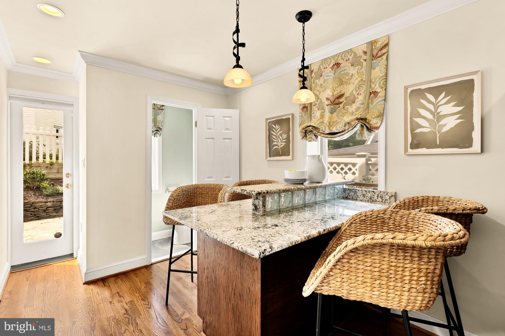 6038 Fort Hunt Road Alexandria, VA 22307 - Photo 22 of 49 a dining room with wooden floor and a chandelier