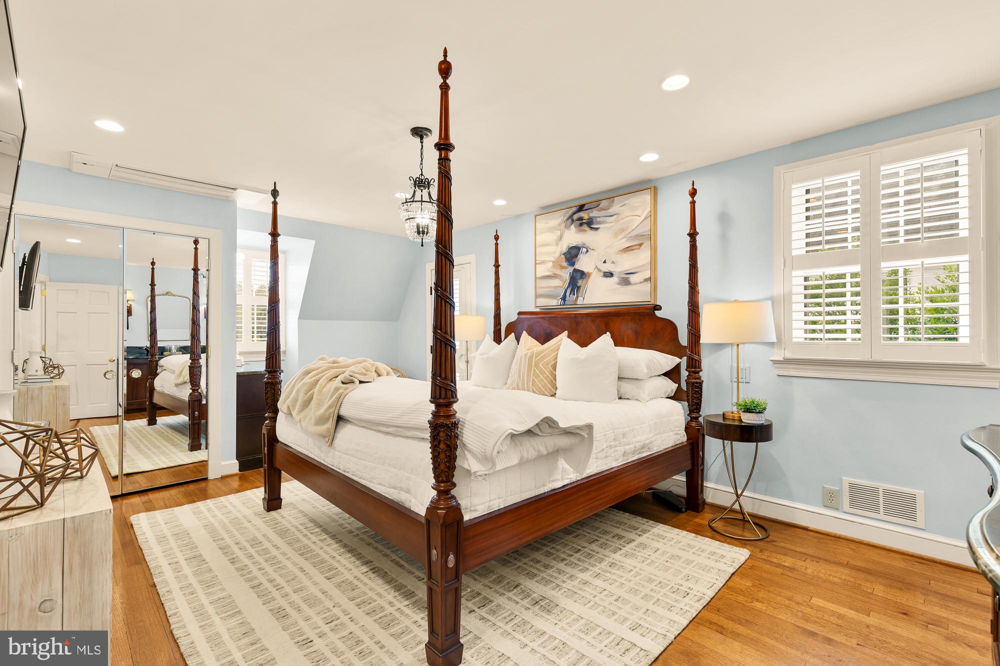 6038 Fort Hunt Road Alexandria, VA 22307 - Photo 26 of 49 a large bedroom with a bed and wooden floor