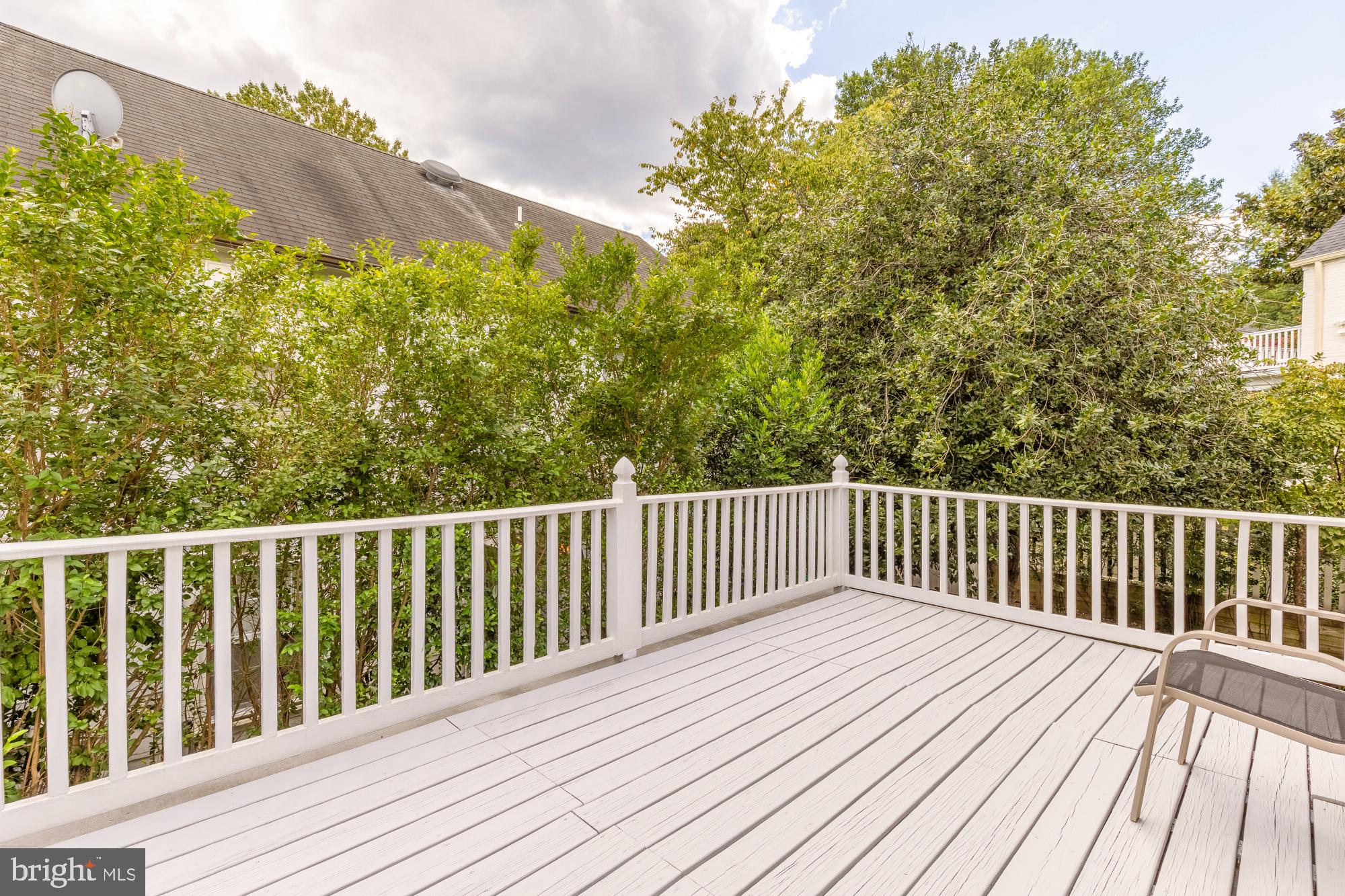 6038 Fort Hunt Road Alexandria, VA 22307 - Photo 30 of 49 a balcony with wooden floor and trees in the background