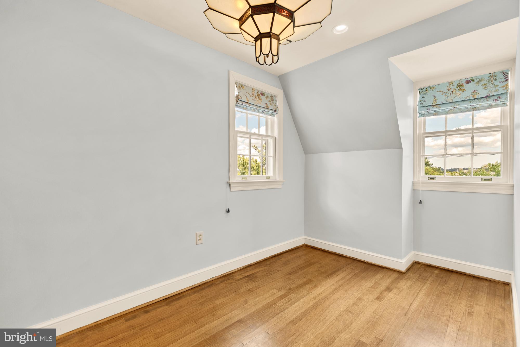 6038 Fort Hunt Road Alexandria, VA 22307 - Photo 34 of 49 a view of an empty room with wooden floor and a window