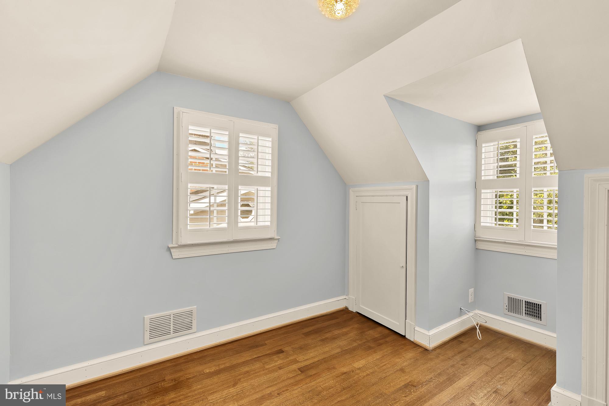 6038 Fort Hunt Road Alexandria, VA 22307 - Photo 37 of 49 an empty room with wooden floor and windows