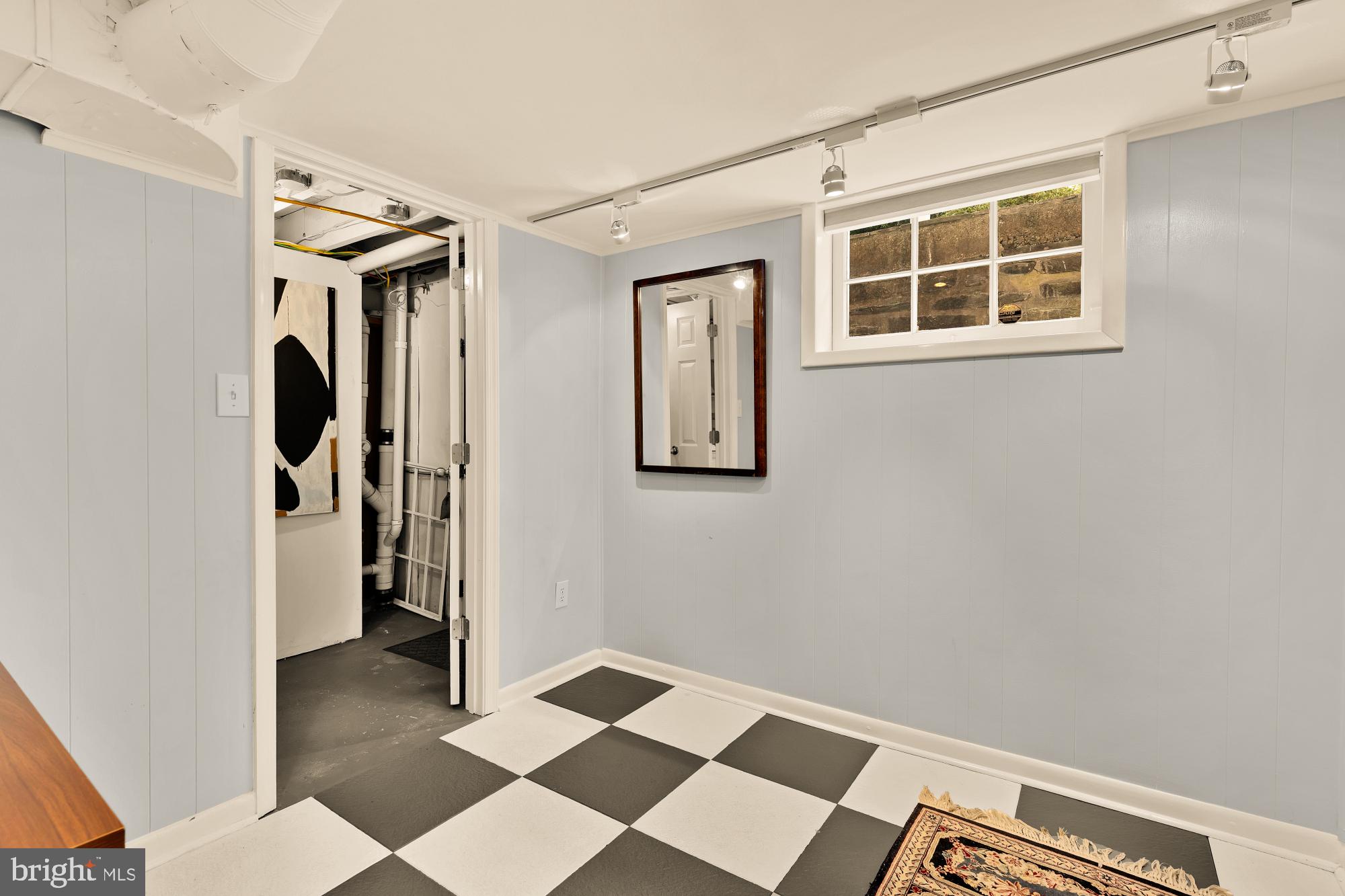6038 Fort Hunt Road Alexandria, VA 22307 - Photo 42 of 49 a view of a hallway with wooden floor and a cabinet
