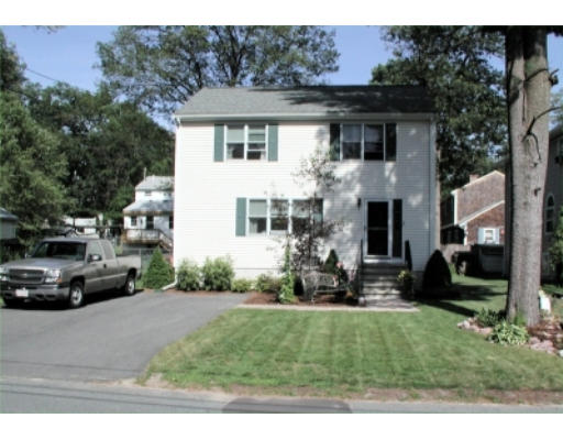 37 Clover Road Holbrook, MA 02343 - Photo 1 of 8 a view of a house with a cars park side of road