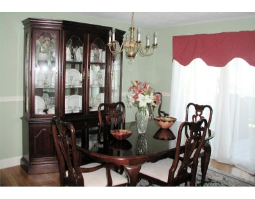 37 Clover Road Holbrook, MA 02343 - Photo 3 of 8 a view of a dining room with furniture and chandelier