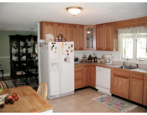 37 Clover Road Holbrook, MA 02343 - Photo 4 of 8 a kitchen with refrigerator and window