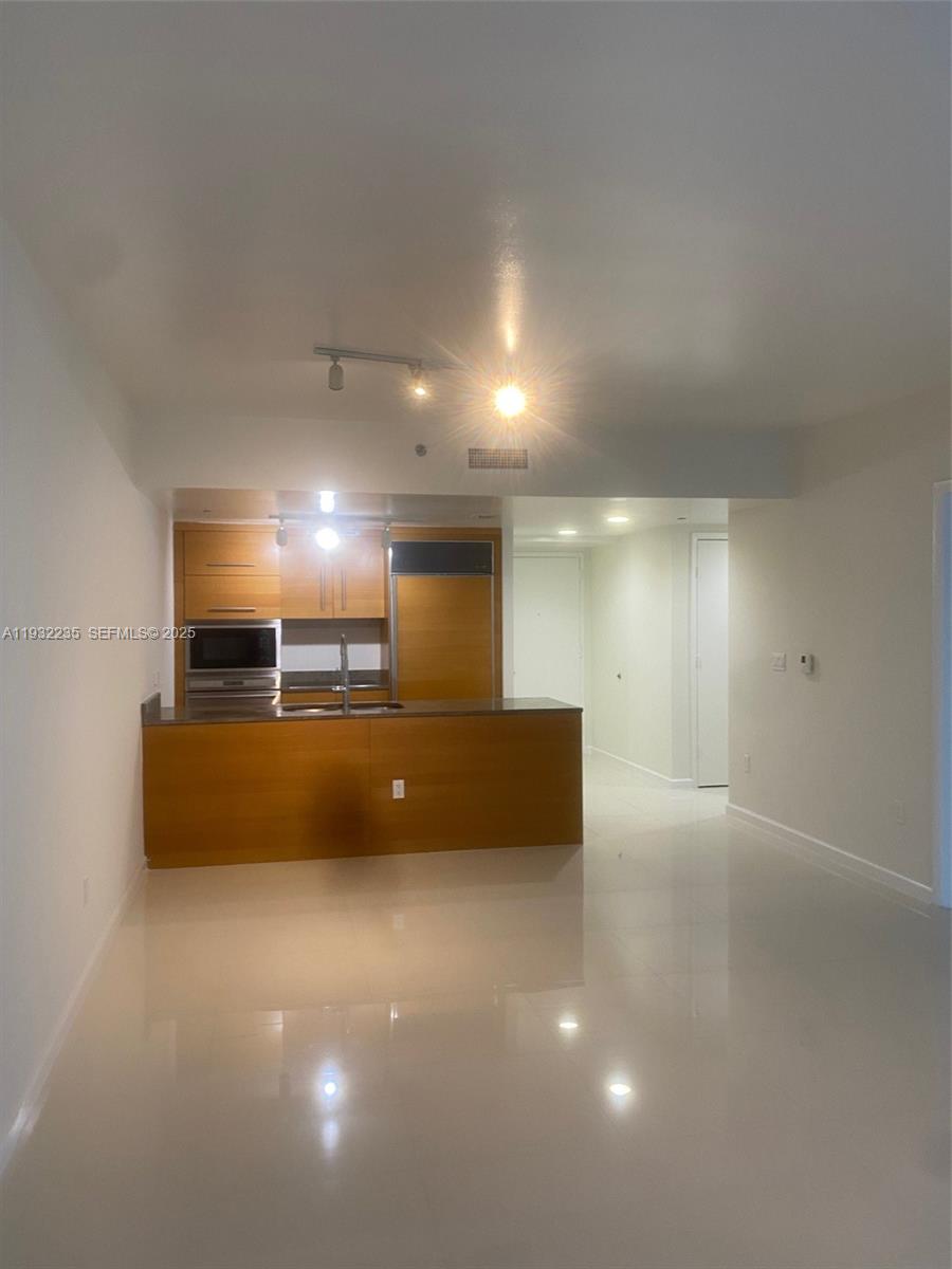 475 Brickell Avenue, Unit 3414 Miami, FL 33131 - Photo 15 of 24 a view of a big room with a projector