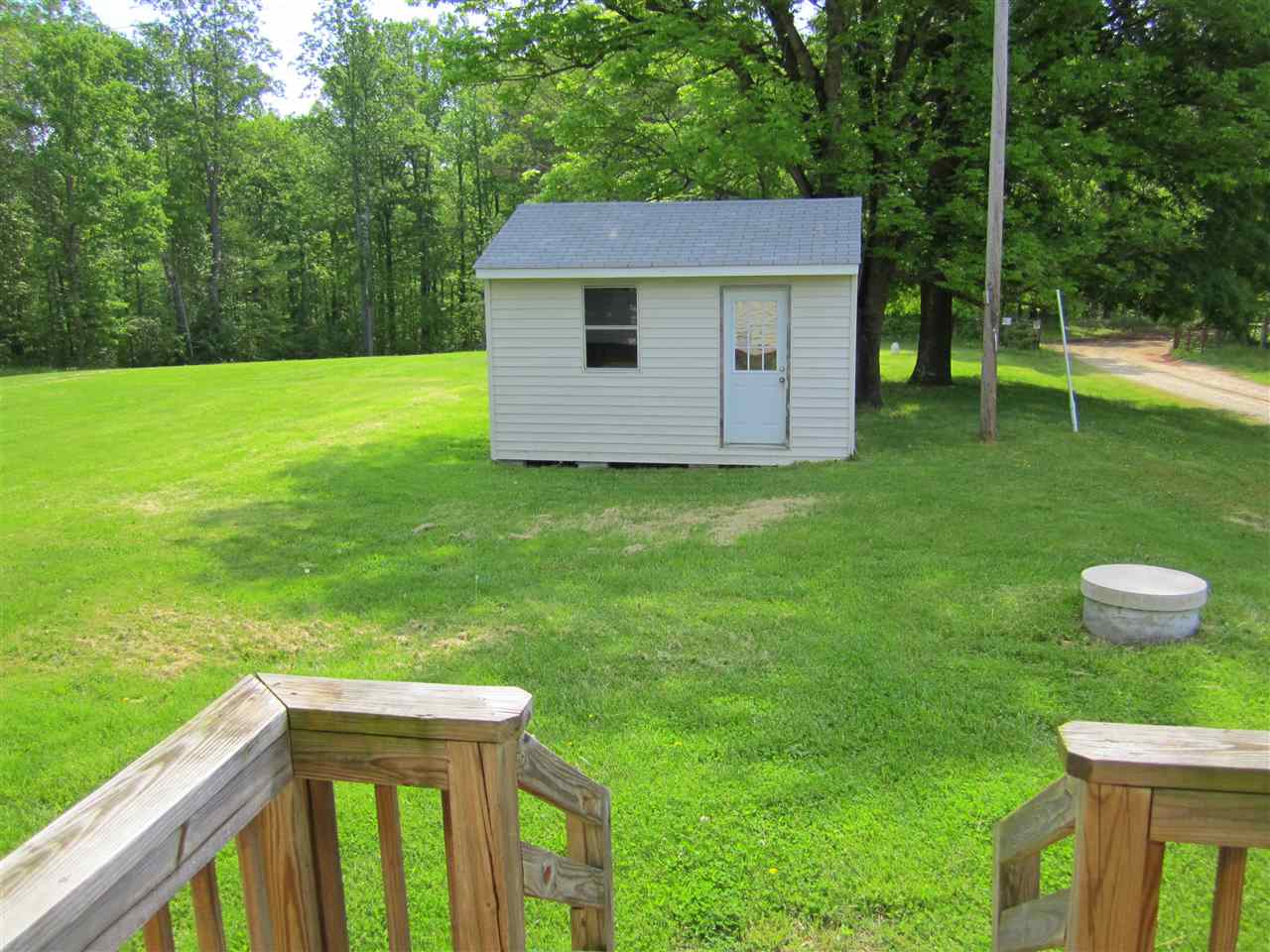 5576 Buckner Road Bumpass, VA 23024 - Photo 11 of 12 a view of a backyard with a garden