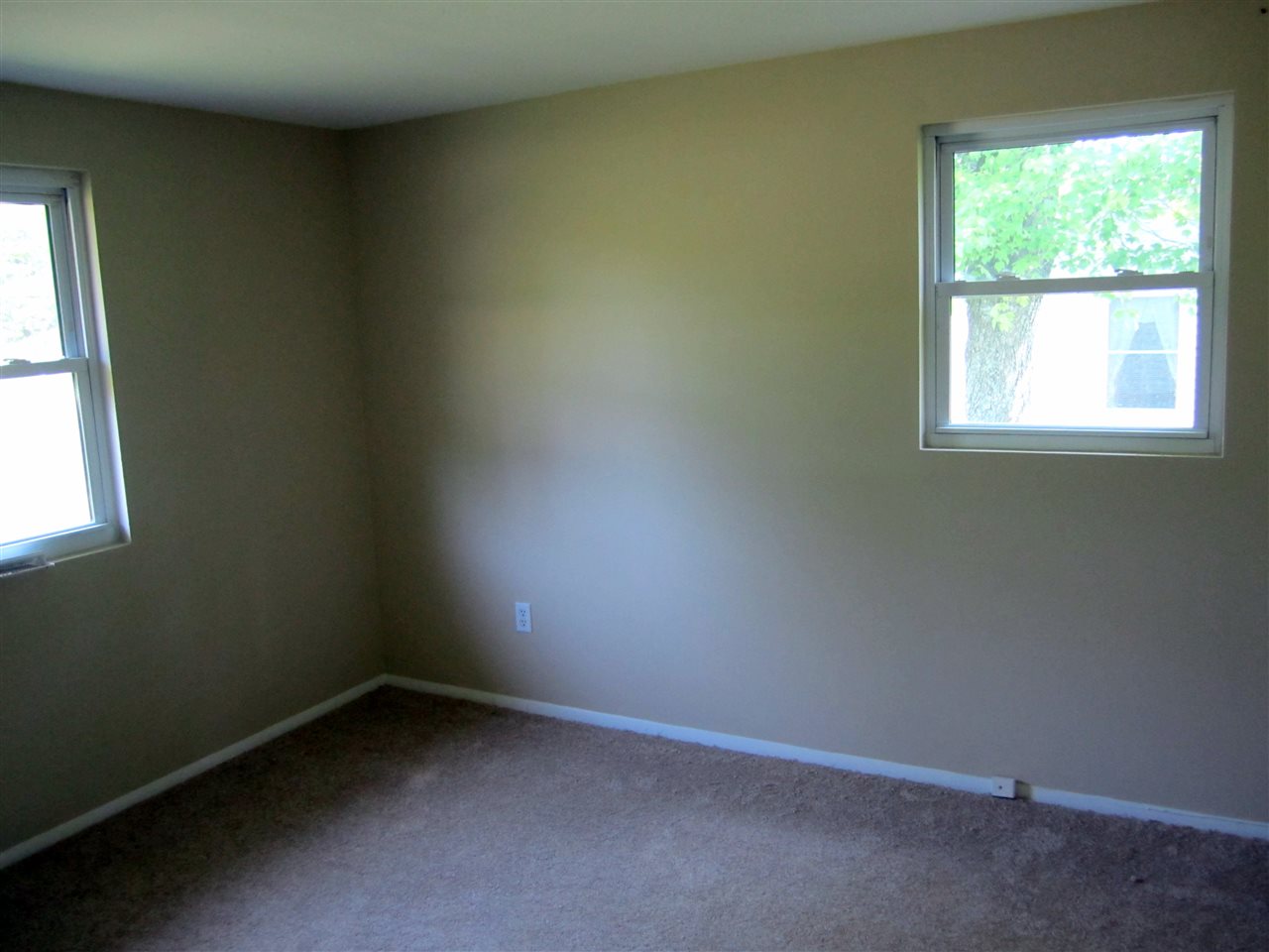 5576 Buckner Road Bumpass, VA 23024 - Photo 5 of 12 an empty room with a window