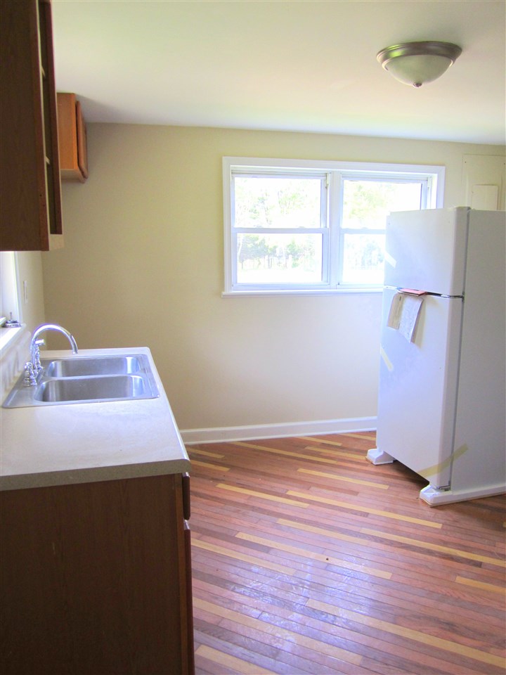 5576 Buckner Road Bumpass, VA 23024 - Photo 9 of 12 a room with a window and wooden floor