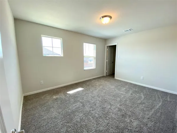 a view of a hallway and wooden floor and stairs