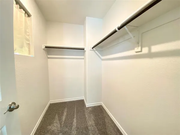 a view of a hallway with closet
