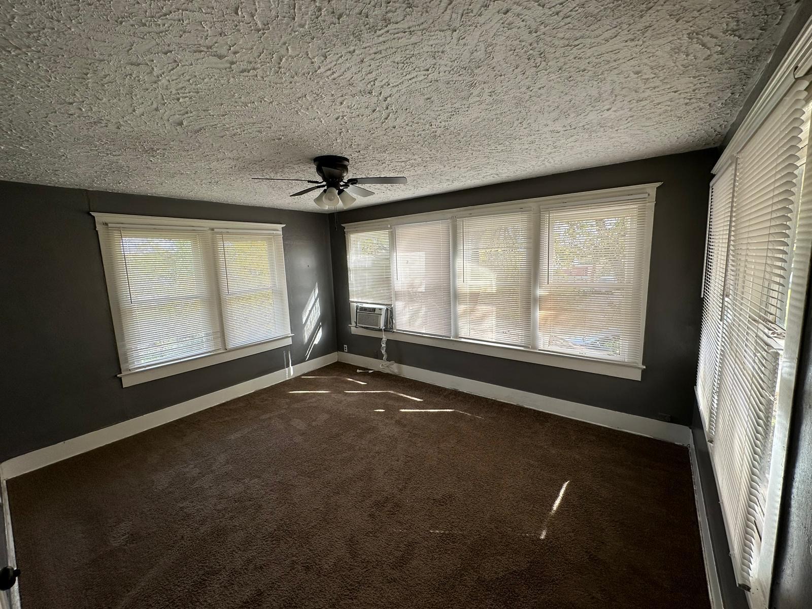 6818 Stearns Street Houston, TX 77021 - Photo 11 of 17 bedroom featuring plush carpeting and neutral tones—perfect for a guest room or home office