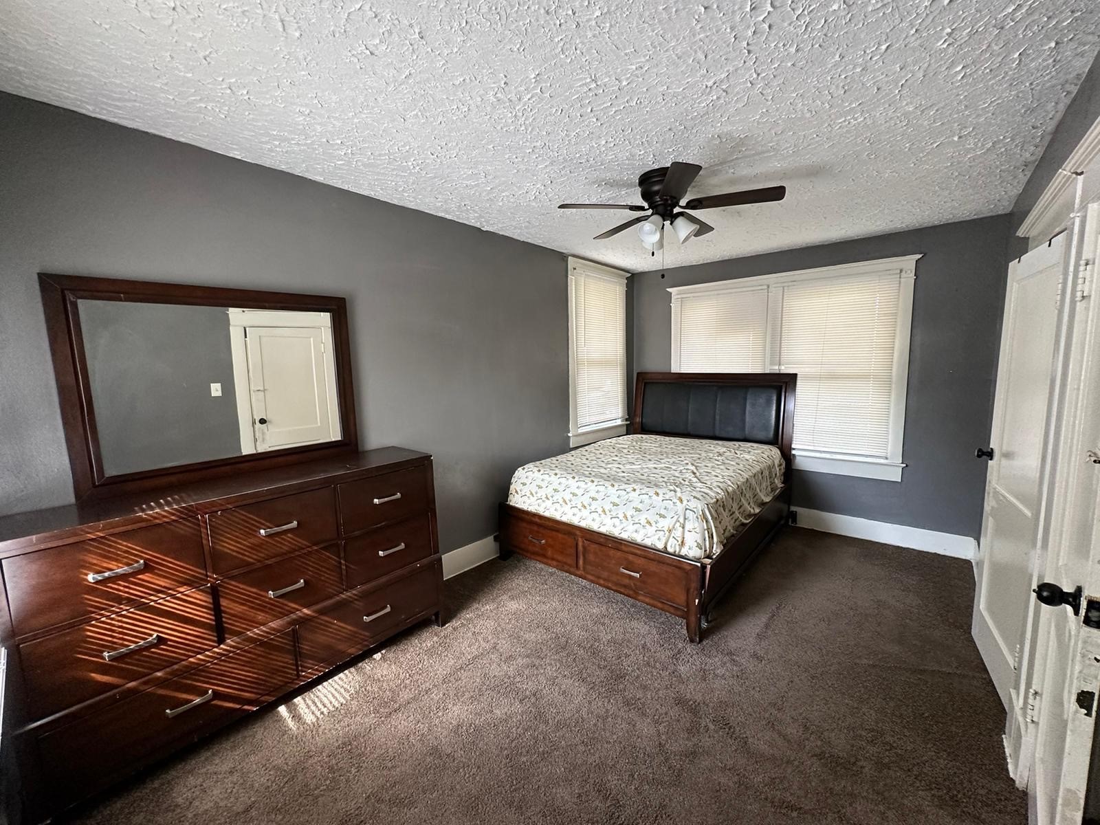 6818 Stearns Street Houston, TX 77021 - Photo 12 of 17 Additional upstairs bedroom with a ceiling fan and ample natural light
