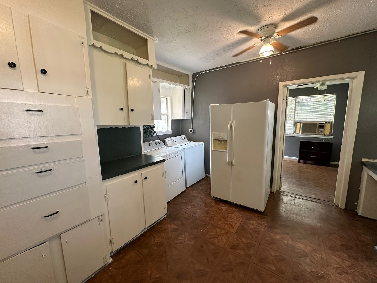 6818 Stearns Street Houston, TX 77021 - Photo 3 of 17 Functional kitchen with ample cabinet storage and full-size appliances.