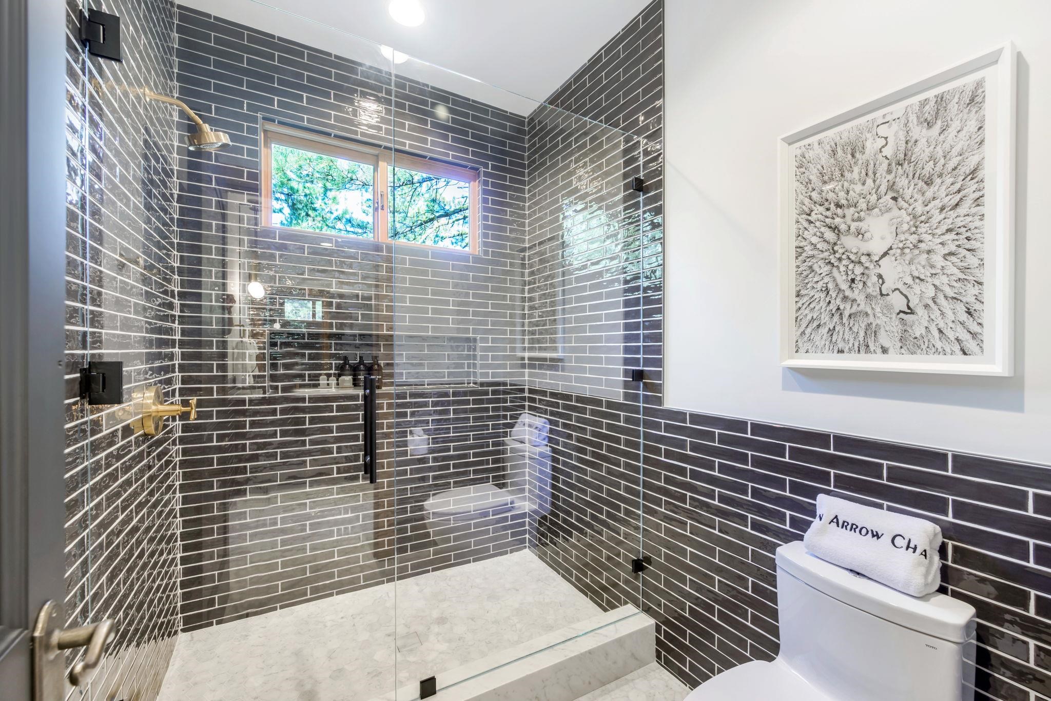 1301 Sandy Way Olympic Valley, CA 96146 - Photo 13 of 21 a bathroom with a toilet and a shower curtain