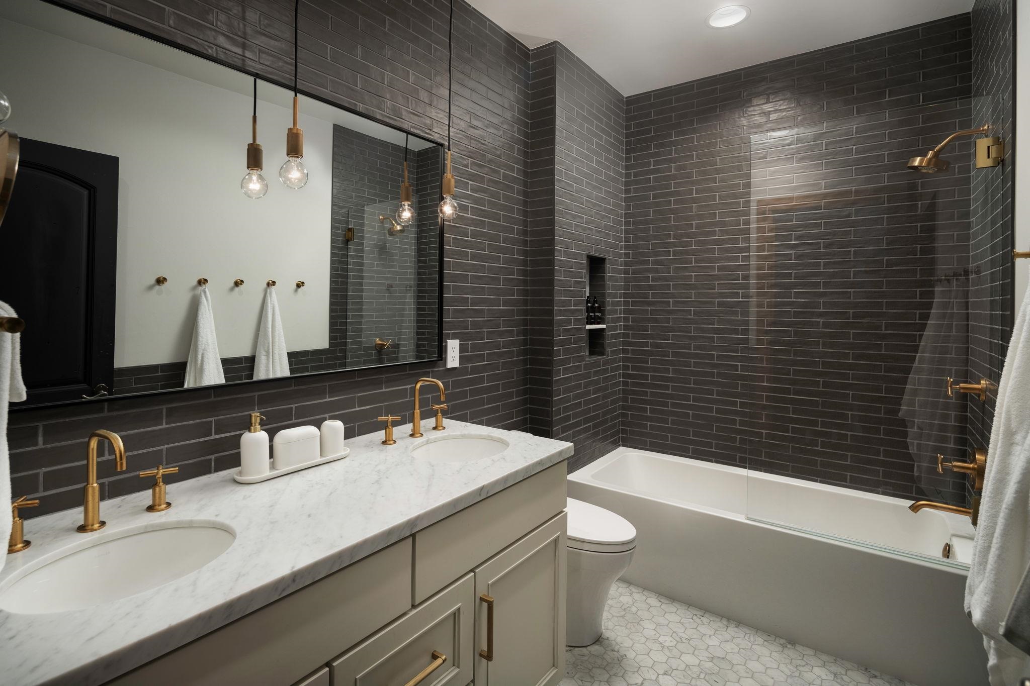 1301 Sandy Way Olympic Valley, CA 96146 - Photo 15 of 21 a bathroom with a granite countertop sink toilet and shower