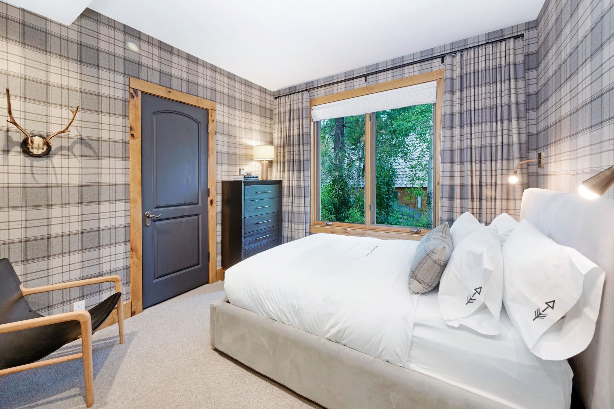 1301 Sandy Way Olympic Valley, CA 96146 - Photo 16 of 21 a bedroom with a bed and wooden floor