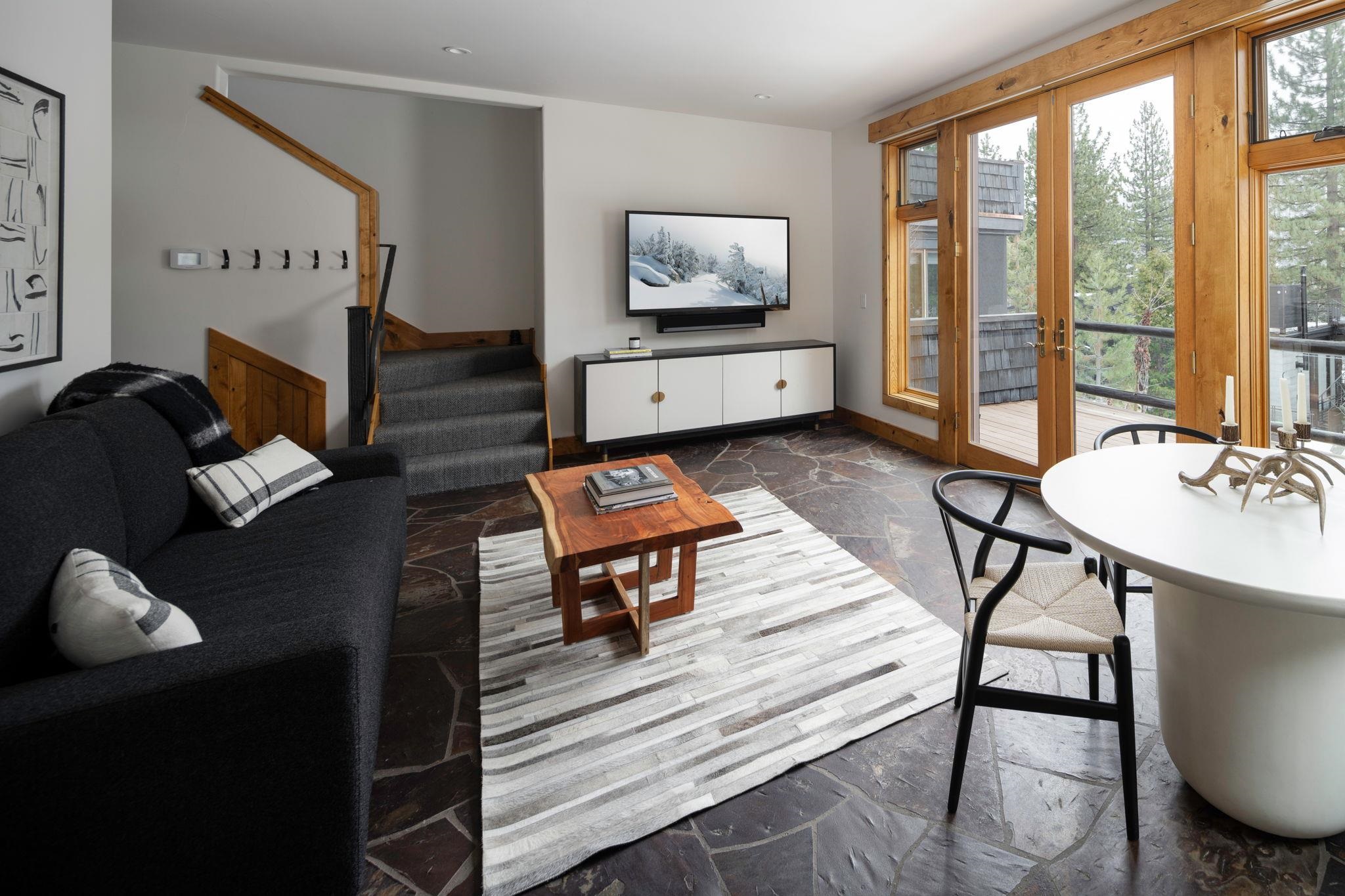 1301 Sandy Way Olympic Valley, CA 96146 - Photo 18 of 21 a living room with furniture a large window and wooden floor
